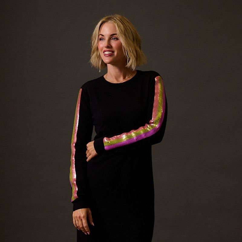 a woman wearing a colourful fleece 