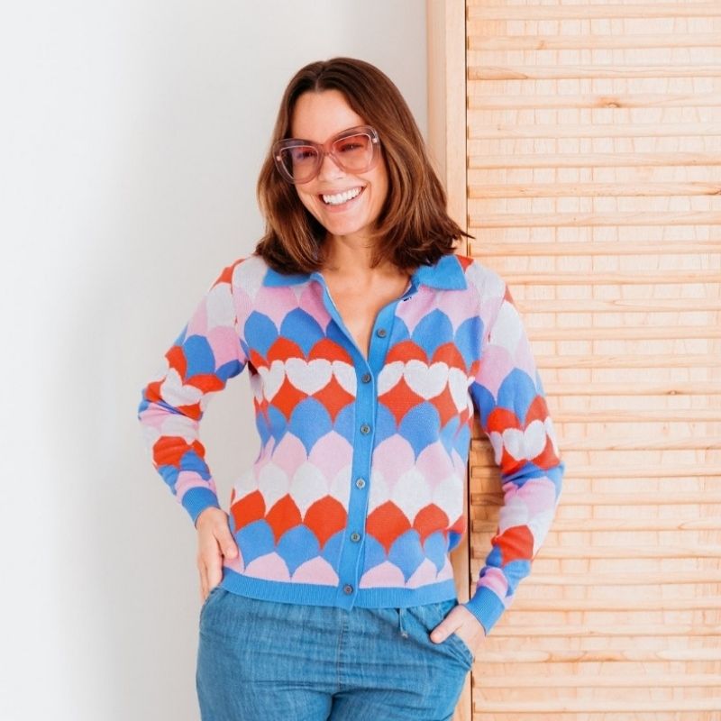 a woman wearing a brightly coloured cardigan 