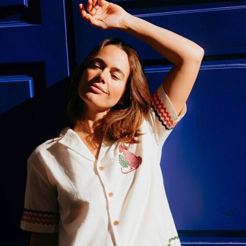 a close up of a model wearing a leopard top