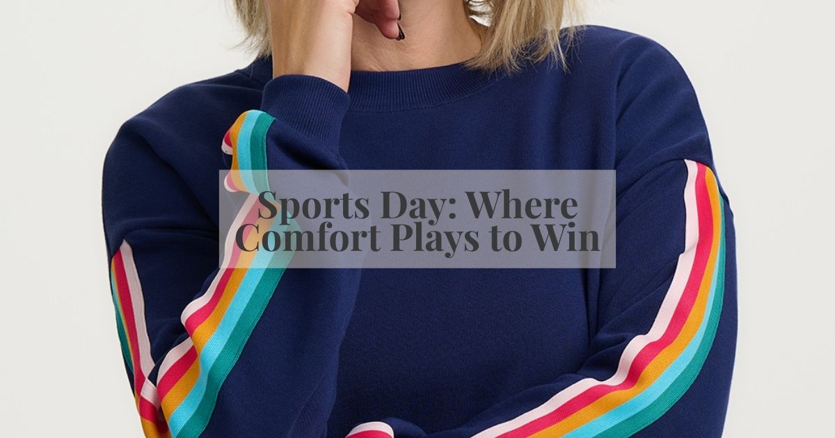 WOMAN MODCELLING A BLACK JMPER WITH CATS ON 