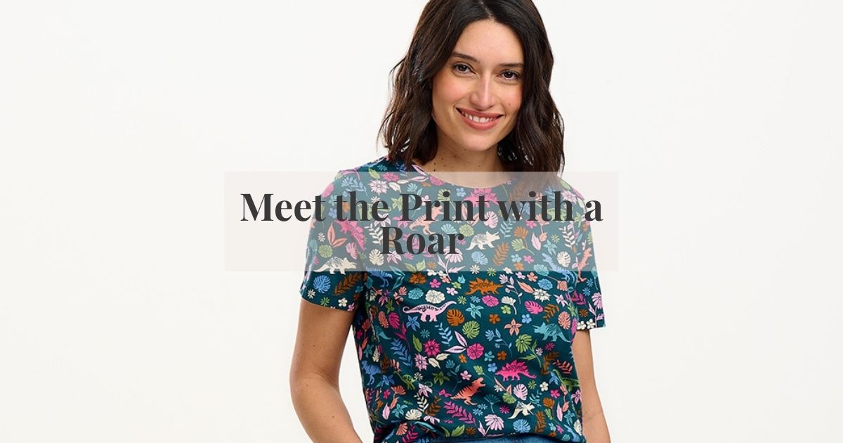 a woman wearing a dinosaur print top 