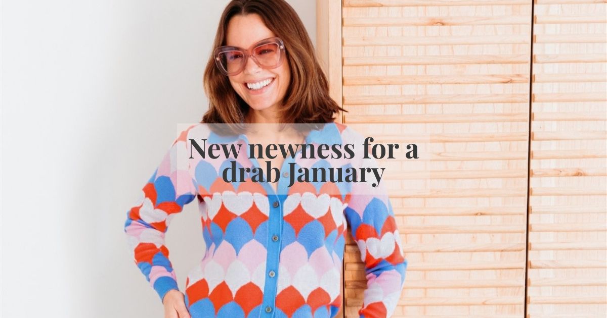 a woman wearing a brightly coloured cardigan 