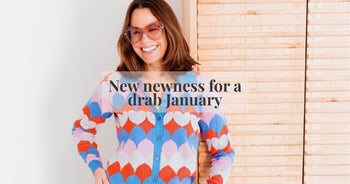 a woman wearing a brightly coloured cardigan 