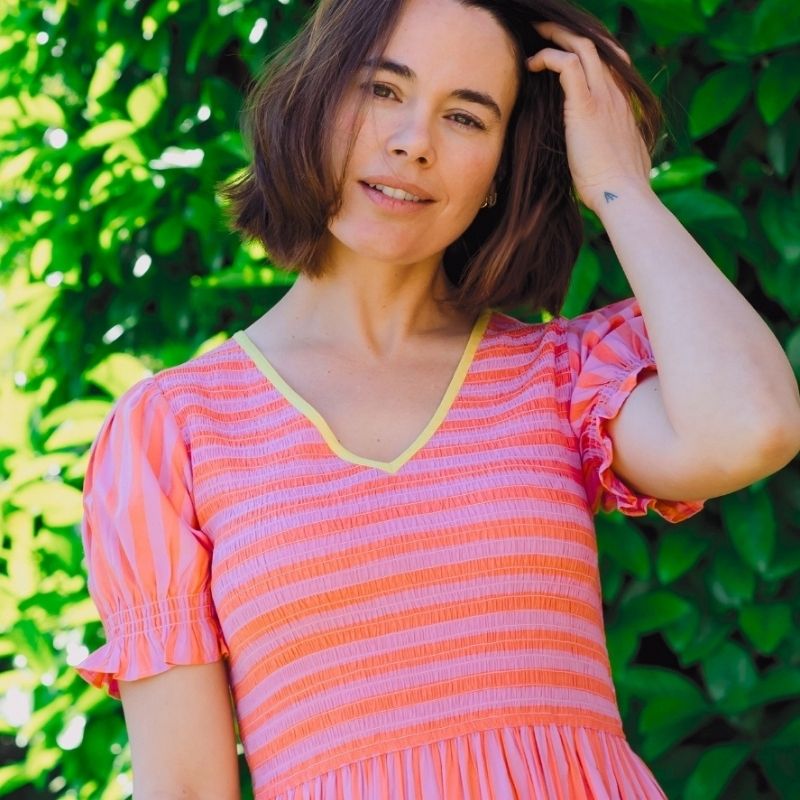 a close up of a coral dress