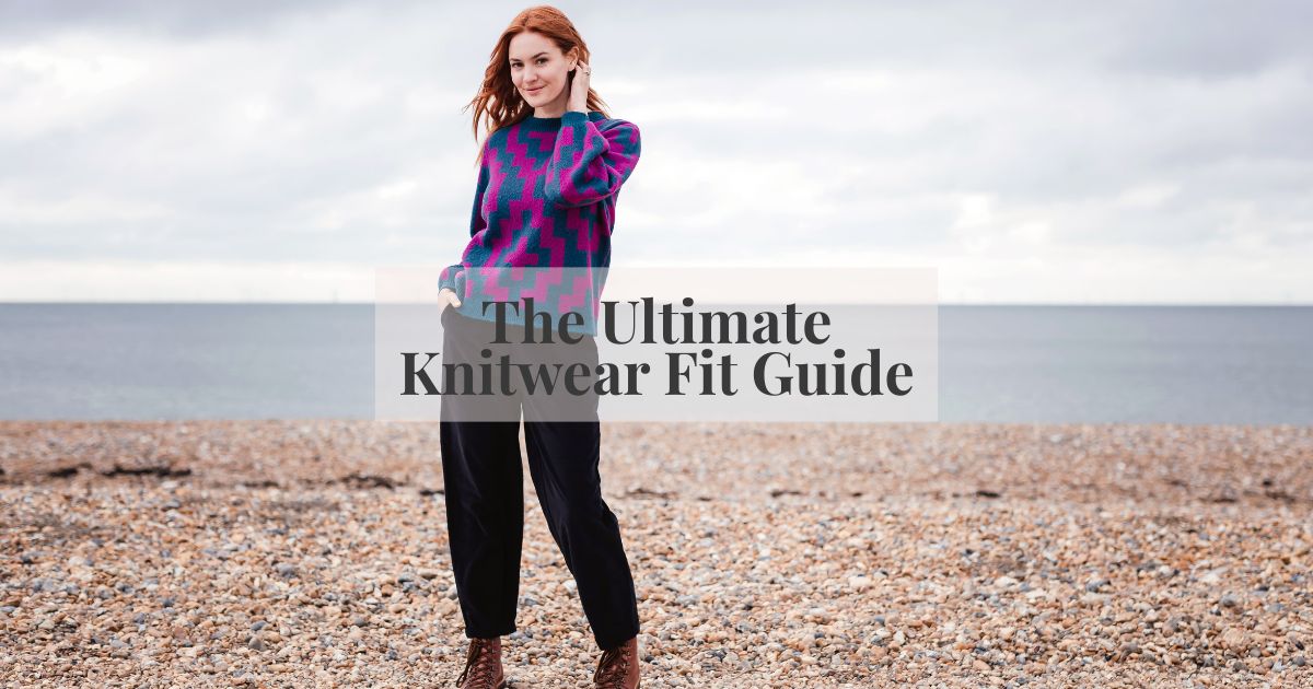 A woman modelling a jumper on the beach 