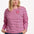 Sugarhill brighton model wearing a pink and black striped sweater with a star accessory on a white background