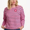 Sugarhill brighton model wearing a pink and black striped sweater with a star accessory on a white background