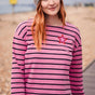 Sugarhill Brighton model wearing pink brenton top on the beach. 