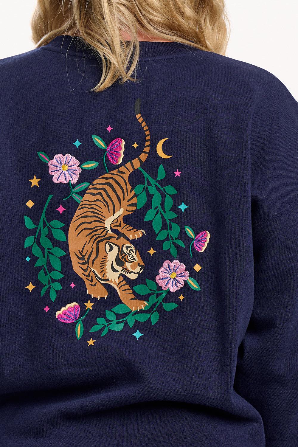 Navy blue sweatshirt with a tiger and floral design on the back