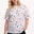 Sugarhill Brighton model wearing a white t-shirt with colorful abstract pattern on a white background