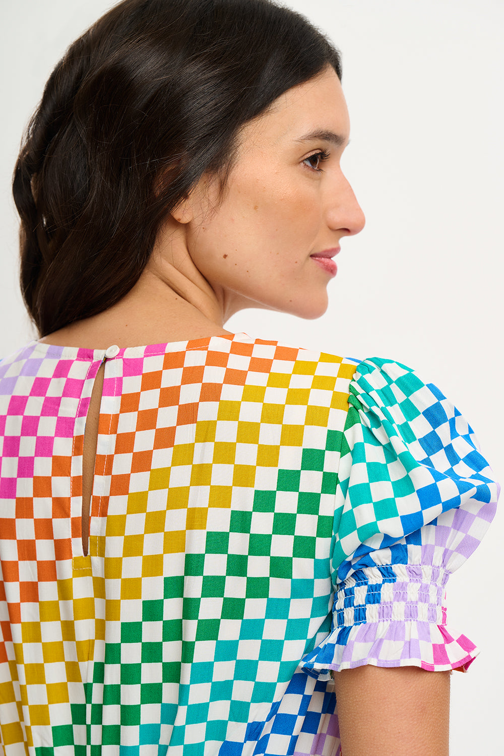 Woman wearing a colorful checkered dress