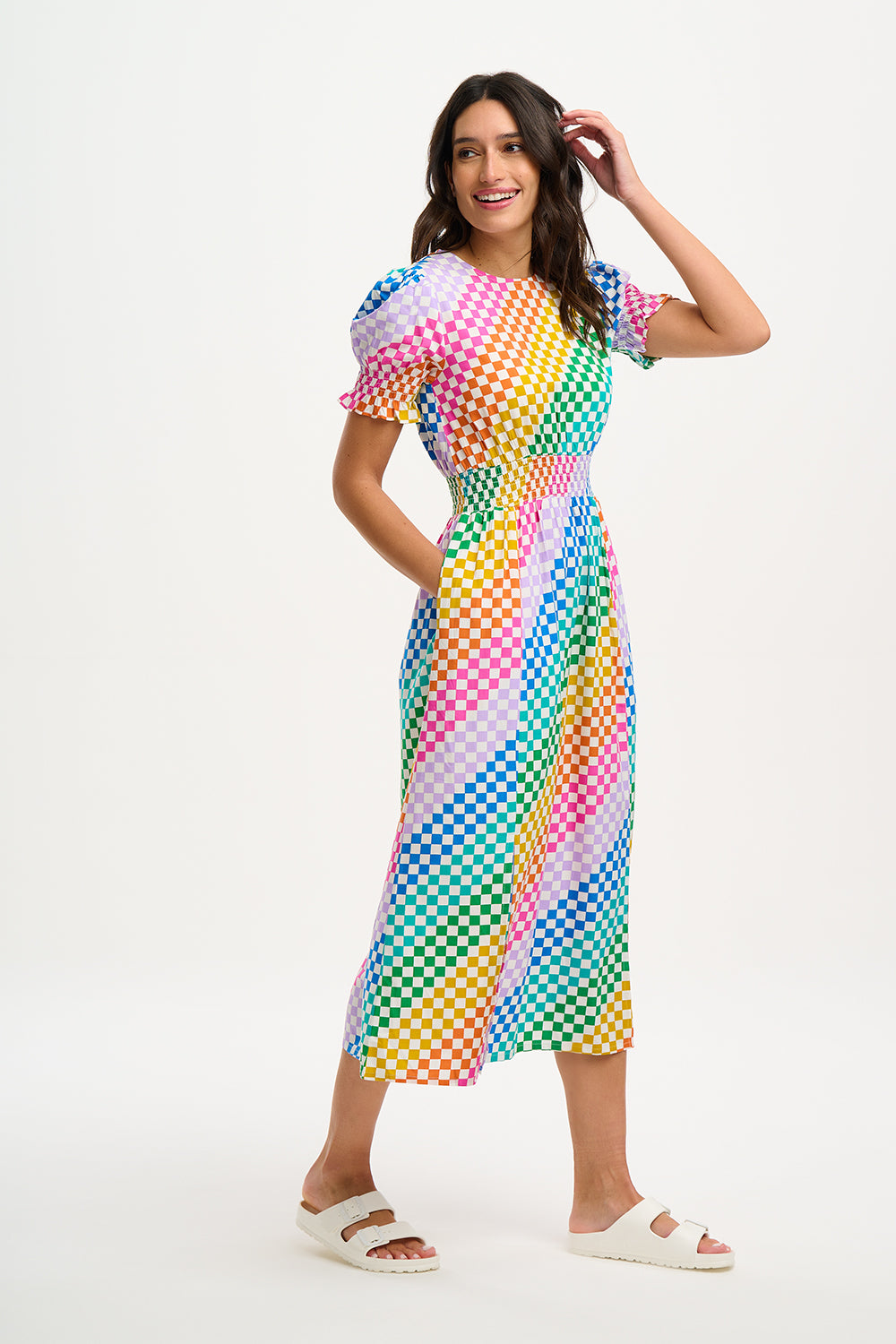 Woman wearing a colorful checkered dress
