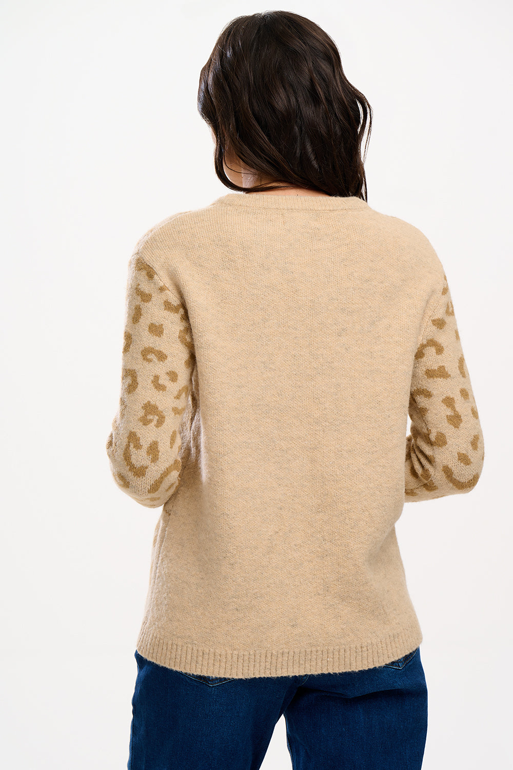 model wearing jumper with large leopard face on it 