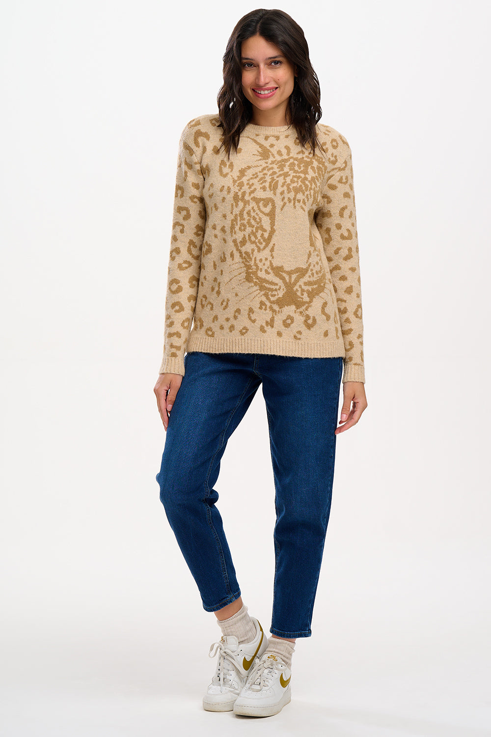 model wearing jumper with large leopard face on it 