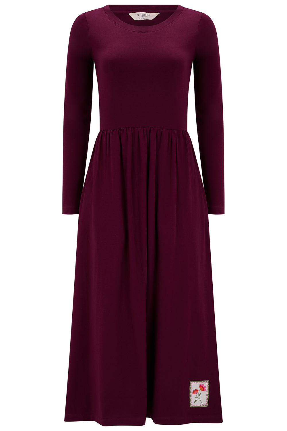 Maroon dress with a label on a white background