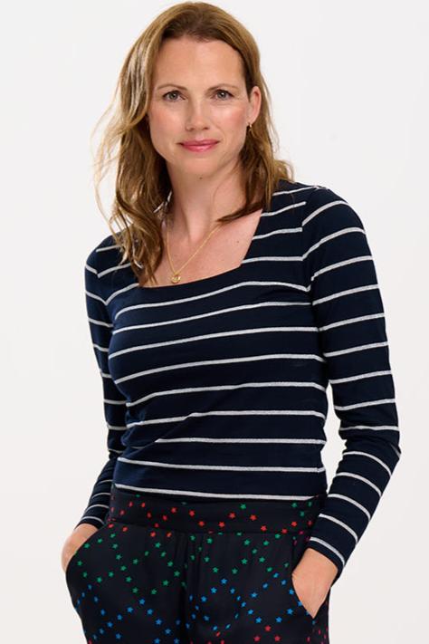 model wearing black top with silver stripes 