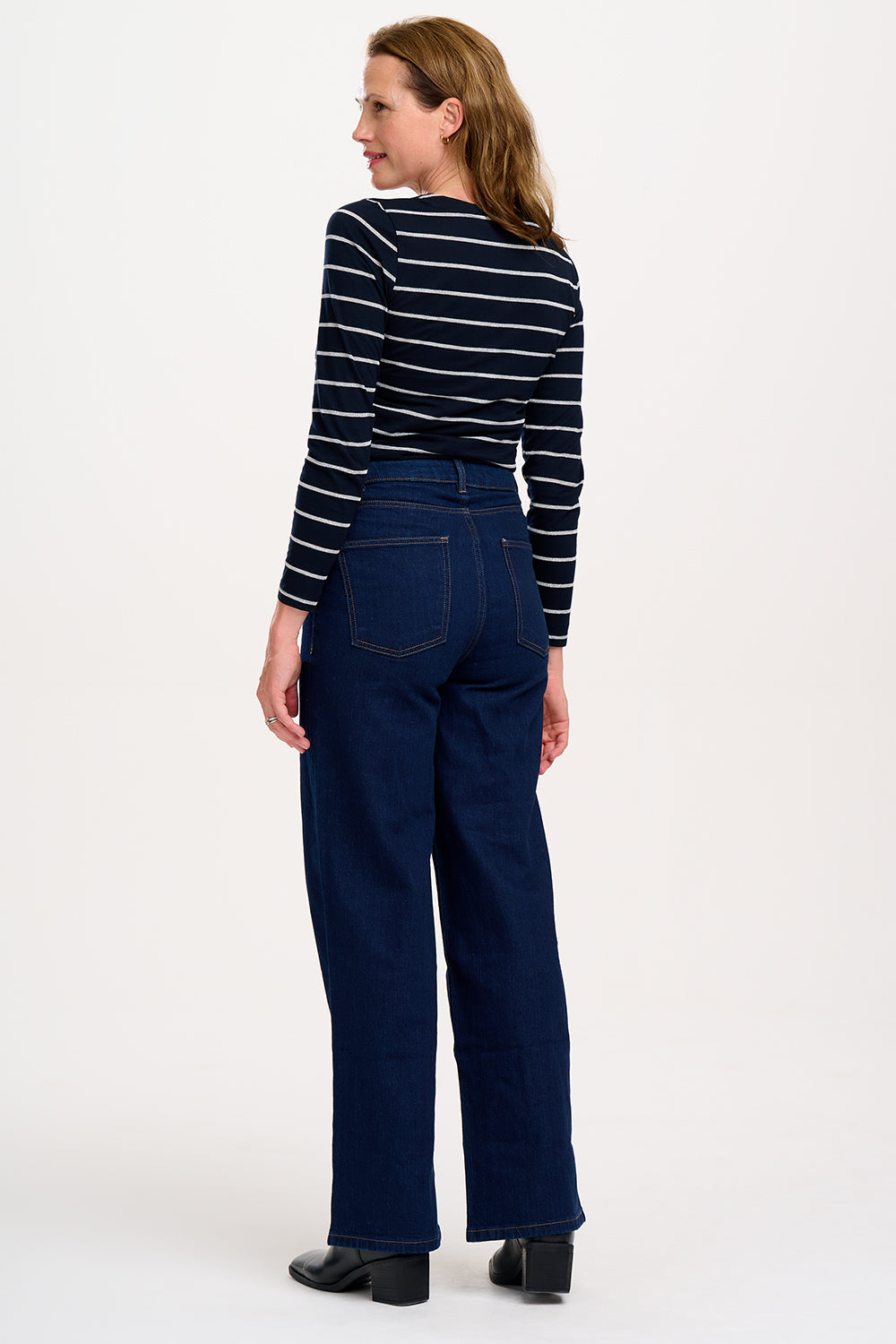 model wearing black top with silver stripes 