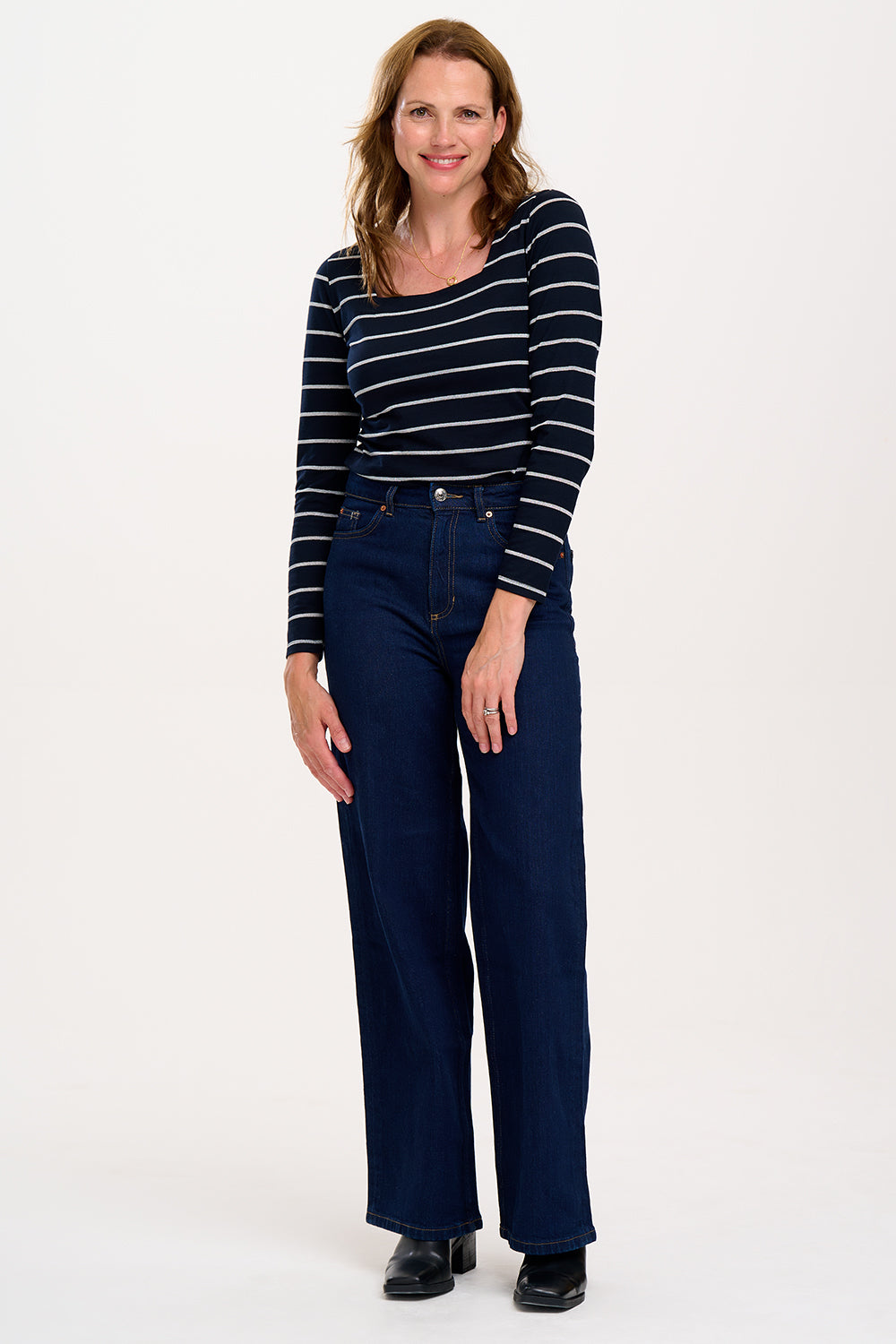 model wearing black top with silver stripes 