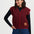Woman wearing a red vest with a logo on a white background