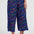 Person wearing colorful wavy-patterned pants on a white background