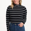 Sugarhill Brighton Sugarhill Brighton Annika Jersey Top - Black/White, Stripe Lightning. Woman wearing a black and white striped sweater with blue jeans on a white background