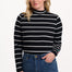 Sugarhill Brighton Sugarhill Brighton Annika Jersey Top - Black/White, Stripe Lightning. Woman wearing a black and white striped sweater with blue jeans on a white background