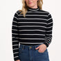 Sugarhill Brighton Sugarhill Brighton Annika Jersey Top - Black/White, Stripe Lightning. Woman wearing a black and white striped sweater with blue jeans on a white background