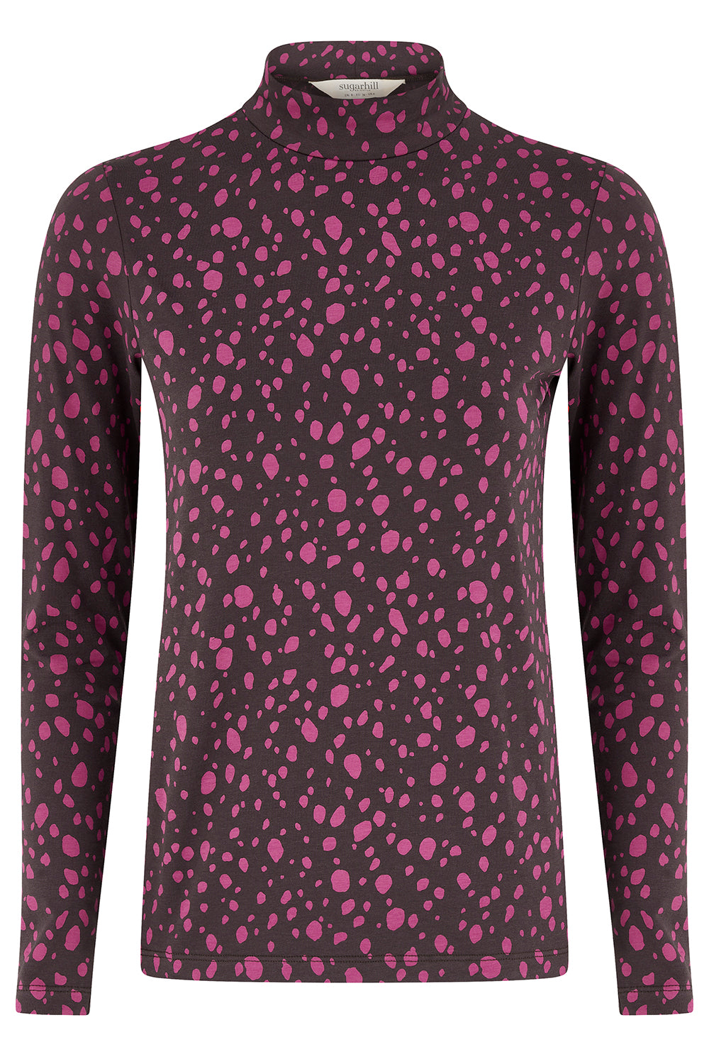 A long-sleeve mock neck top featuring an all-over pink spotted pattern on a dark charcoal gray background.