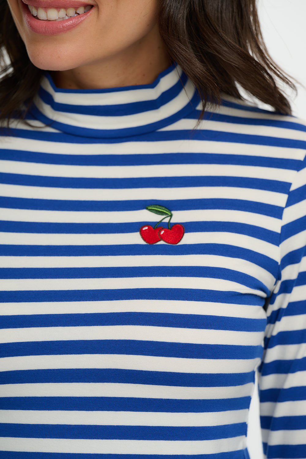 Blue and white striped shirt with a cherry design on a white background