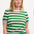 A woman wearing a green and white striped knit top with a crew neck and rainbow tipping on the cuffs and hem.
