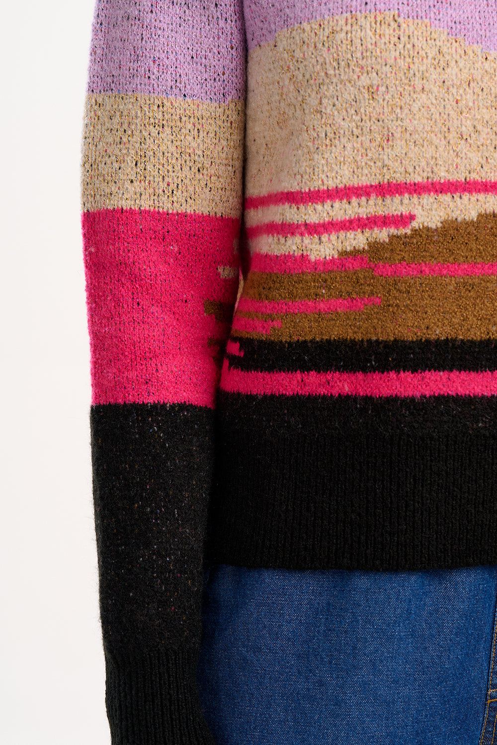 Close-up of a sweater with colorful horizontal stripes on a plain background