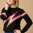 A female model wearing a black, berry and biscuit colored jumper with a crew neck and long sleeves.