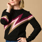 A female model wearing a black, berry and biscuit colored jumper with a crew neck and long sleeves.