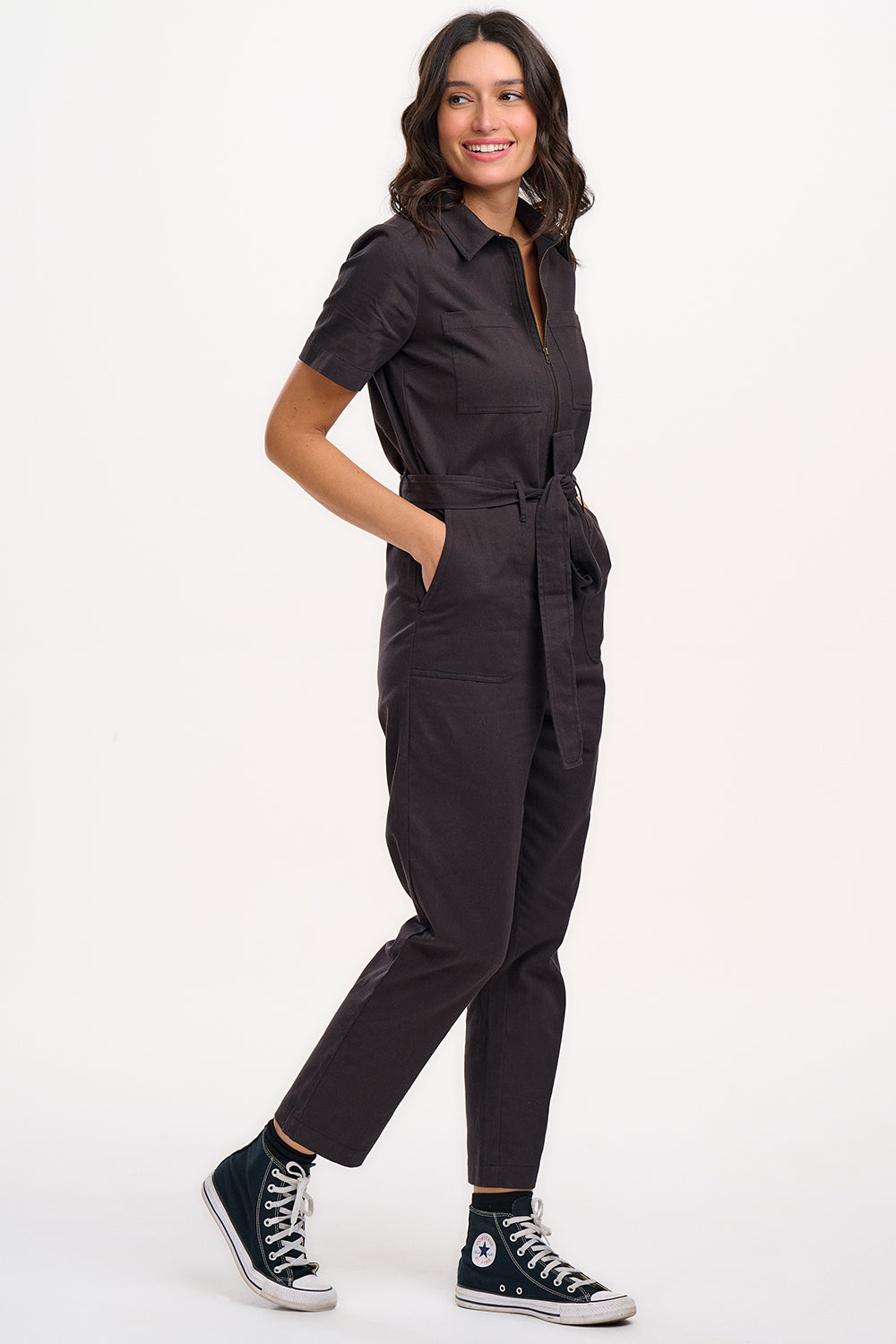 A black boilersuit with half-sleeve shirt top and straight legs, featuring a floral and tiger embroidery on the back.