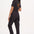 A black boilersuit with half-sleeve shirt top and straight legs, featuring a floral and tiger embroidery on the back.
