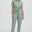 Woman wearing a light green jumpsuit on a white background