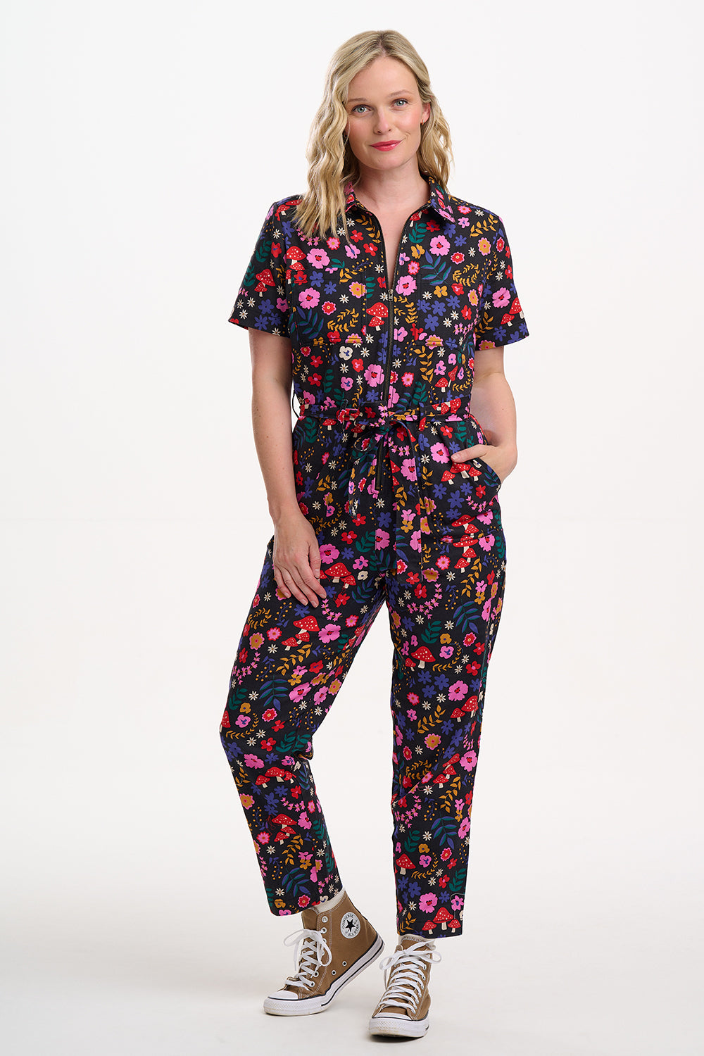 Sugarhill Brighton model wearing a colourful floral jumpsuit on a white background