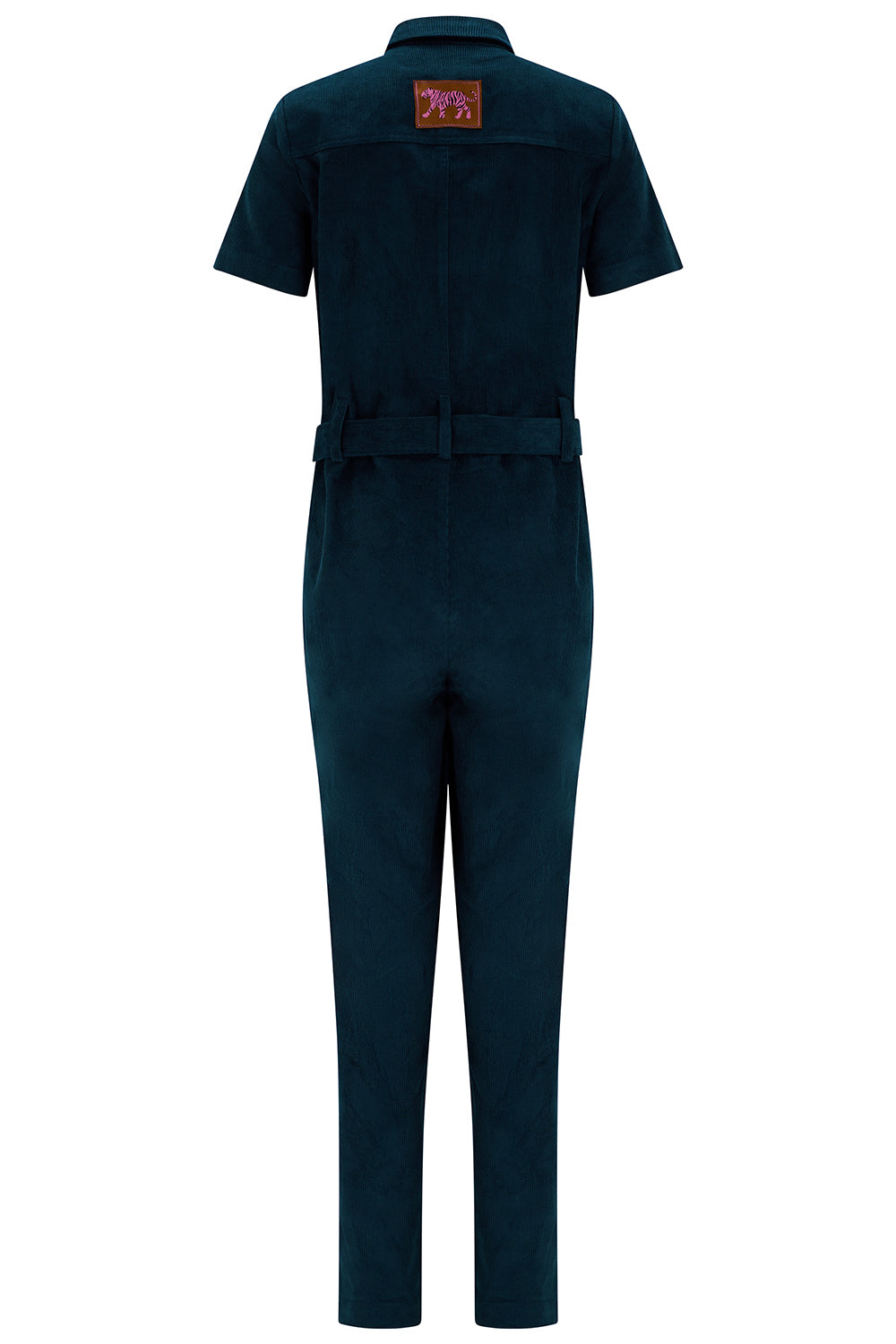 A dark teal short-sleeve jumpsuit shown from the back, featuring a matching waist belt and a small embroidered patch on the upper back, set against a plain white background.
