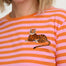 Person wearing a pink and orange striped shirt with a tiger design.