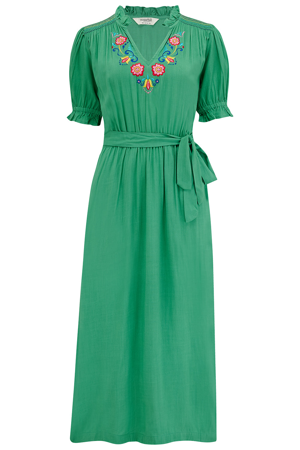 A green midi dress with folk floral embroidery on the neckline and sleeves, displayed on a plain background.