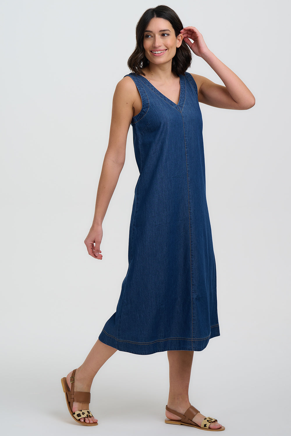 Woman wearing a blue dress on a white background