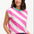 Sugarhill Brighton t-shirt. A female model wearing an oversized sleeveless striped t-shirt in pink and white, paired with blue jeans.