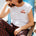 Woman wearing a white t-shirt with a colourful strawberry design