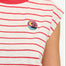 Woman wearing a red and white striped shirt with a colorful logo on a white background