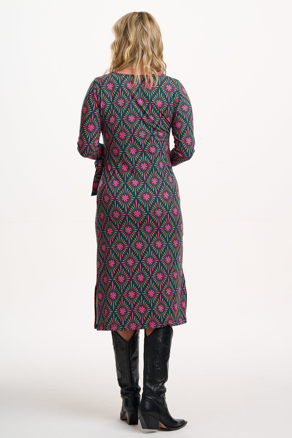 Sugarhill Brighton model wearing a patterned dress with a white background