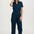Woman wearing a navy blue jumpsuit on a white background
