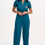 A woman modeling a teal-colored jumpsuit with short sleeves, a front zip, and wide flared legs. The jumpsuit features a pocket on the chest area and is embroidered with a rainbow parrot design.