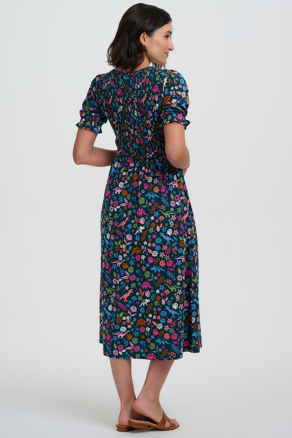 Woman wearing a floral dress on a white background