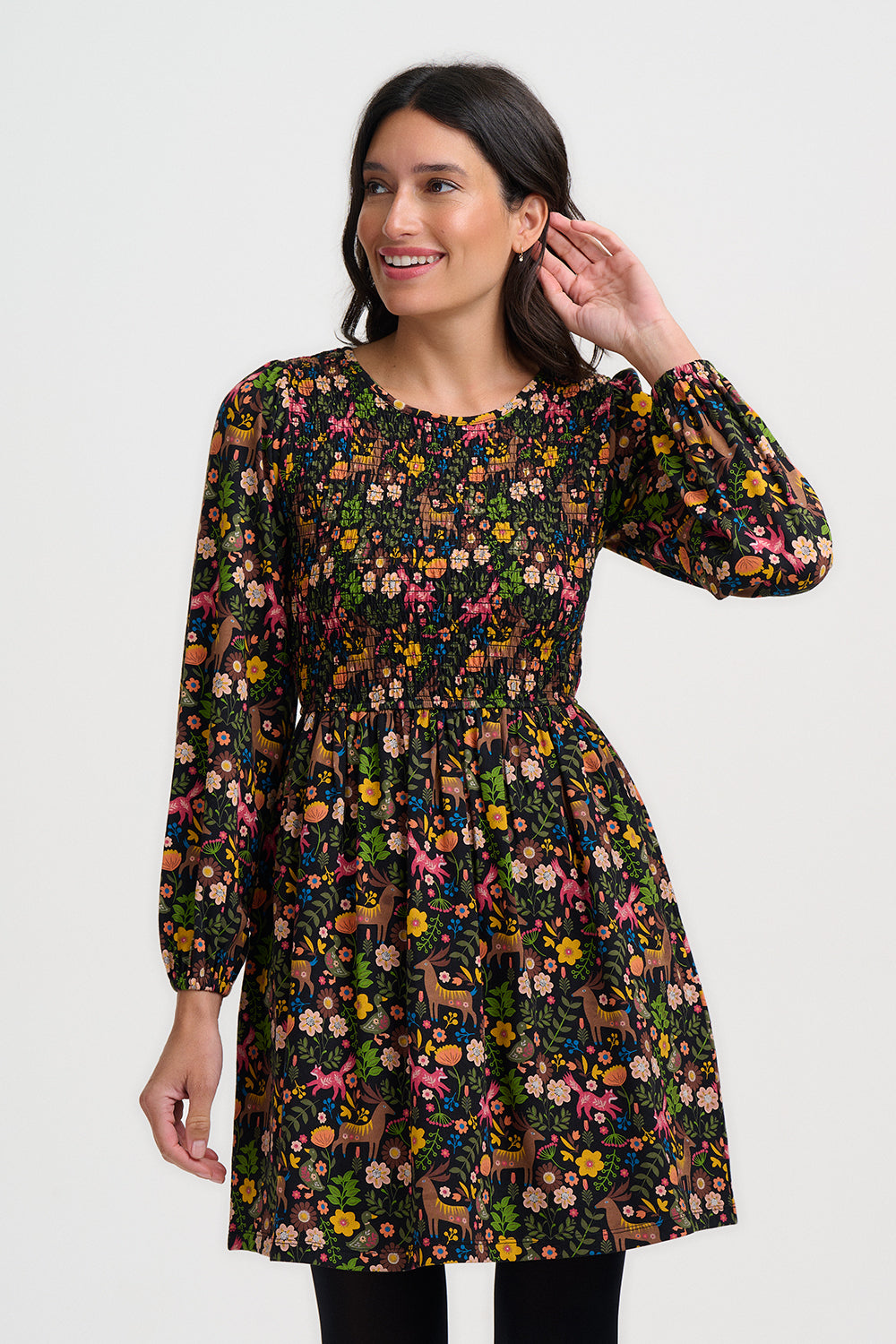 Woman wearing a floral dress on a white background