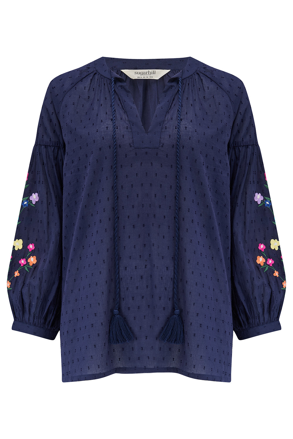 A navy blue boho top with embroidered flowers on the sleeves, featuring a deep V-neck with tassel ties and 3/4 length sleeves.
